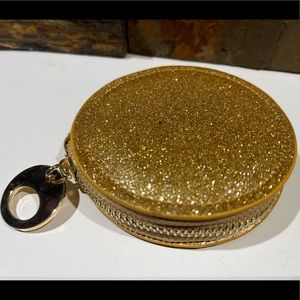 Women’s small round gold clutch